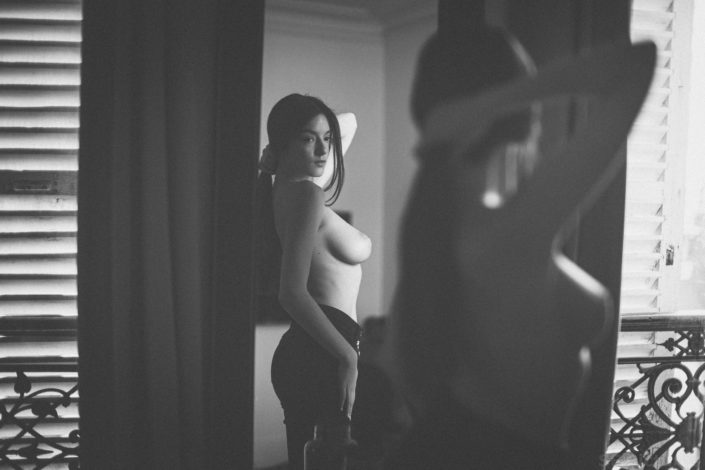 Busty brunette Arina beautiful girl posing topless in the mirror in black and white picture