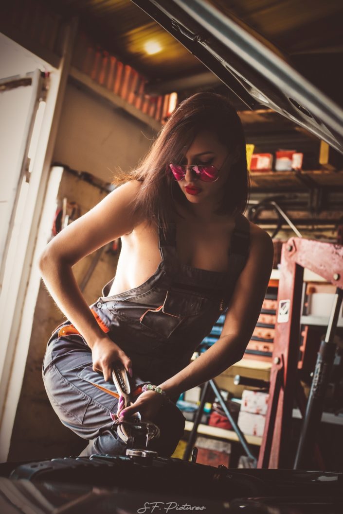 Stunning girl Katerina as a mechanic girl posing in the garage