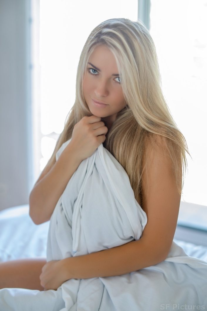 Sensual beauty Manni beautiful blonde girl in the bed for boudoir photography in Paris