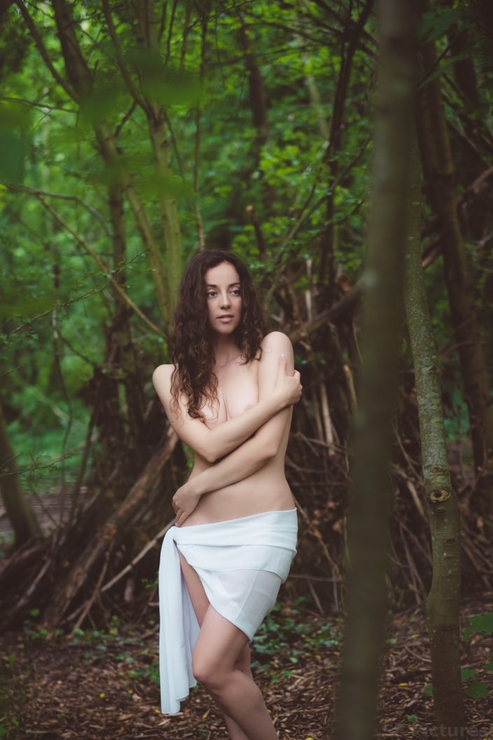 gorgeous model topless with a scarf in the woods